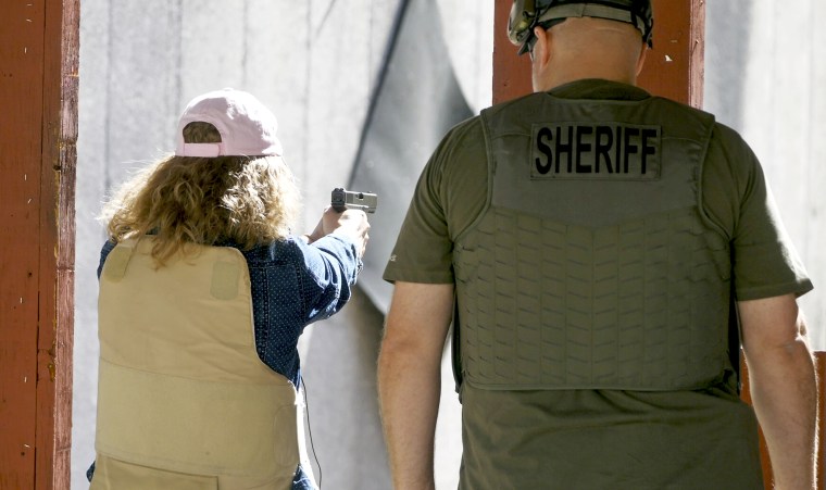 Cindy Bullock, Timpanogos Academy secretary, participates in shooting drills at the Utah County Sheriff's Office shooting range during the teacher's academy training, in Spanish Fork Canyon, Utah on June 29, 2019.