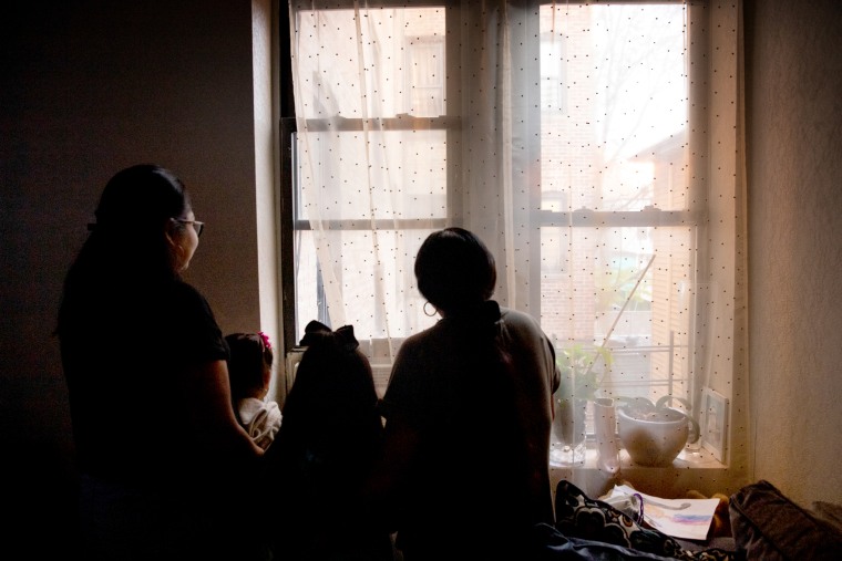 Image: A photo of \"Esperanza,\" a DACA recipient, with her two daughters and her mother at their home in the Bronx, New York.