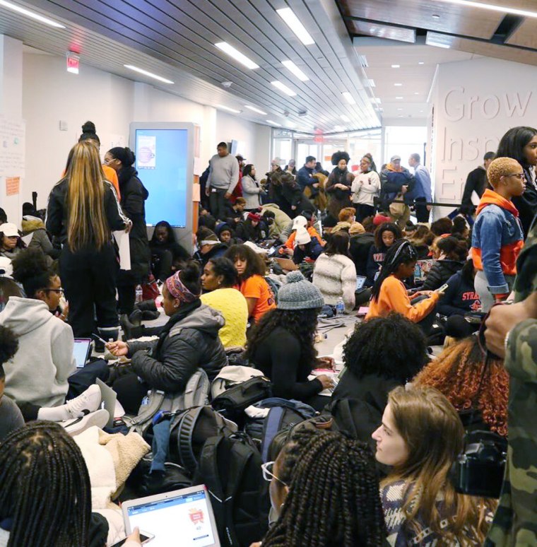 Image: Syracuse University students participate in a campus sit-in after the school experienced a series of racist incidents.