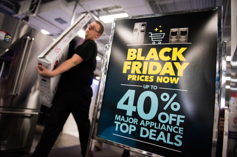 Image: An advertisement for Black Friday sales on appliances stands on display at a Best Buy Inc. store in Paramus, New Jersey.
