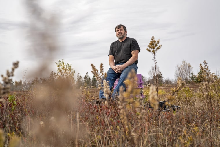 Greg Bridges sits in a 100-acre wild blueberry field that he recently sold in Charlotte, Maine.