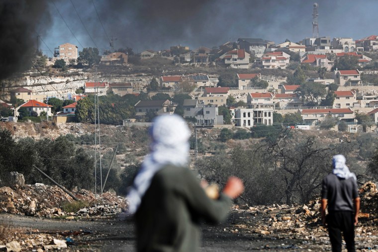 Palestinian demonstrators protest the Jewish settlements in Kofr Qadom, in the Israeli-occupied West Bank, on Nov. 22, 2019.