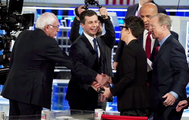 Image: Democratic presidential candidates Sanders, Buttigieg, Booker and Steyer all thank moderator and MSNBC host Rachel Maddow after the conclusion of the U.S. Democratic presidential candidates debate at the Tyler Perry Studios in Atlanta