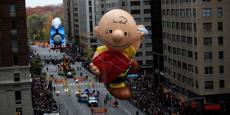 Image: A Charlie Brown giant balloon makes its way down 6th Avenue during the 90th Macy's Thanksgiving Day Parade in the Manhattan borough of New York