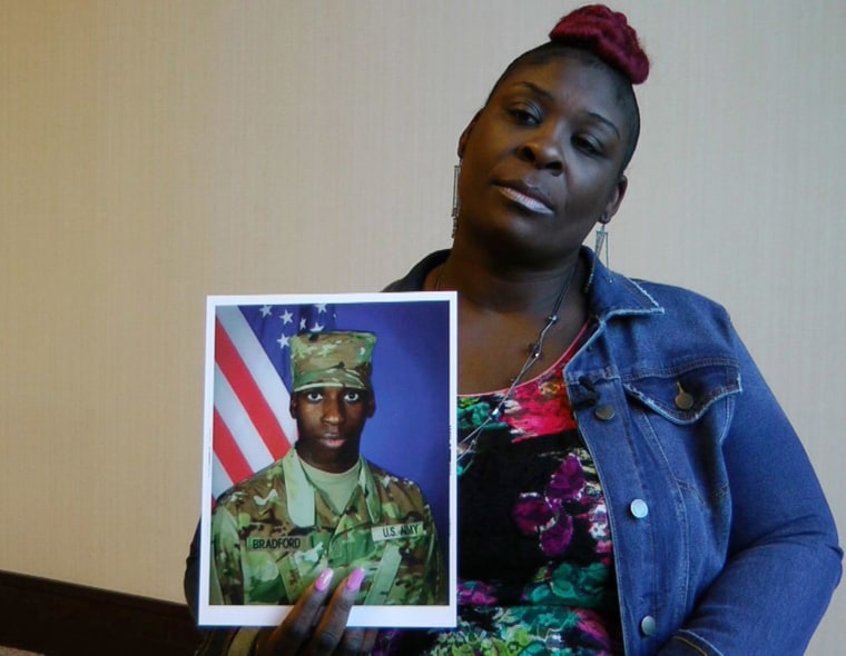 April Pipkins holds a photograph of her deceased son, Emantic "EJ" Bradford Jr., during an interview in Birmingham on Nov. 27, 2018.