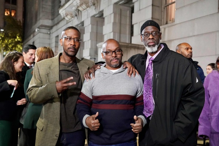 Image: Alfred Chesnut, Andrew Stewart and Ransom Watkins pose for a photo after their exoneration in Baltimore on Nov. 25, 2019.