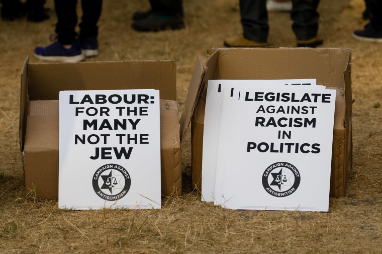 Image: Placards protesting anti-Semitism at a protest in Parliament Square, London on July 19, 2018