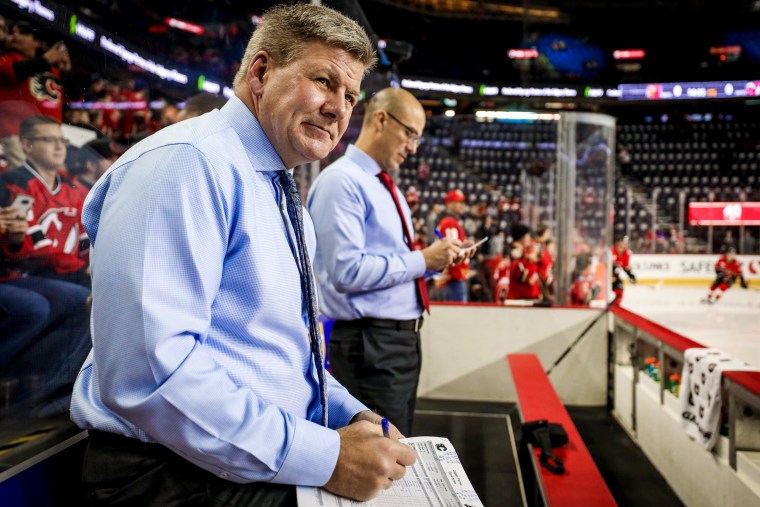 Image: Calgary Flames head coach Bill Peters looks on during warm-ups before a game against the New Jersey Devils on Nov. 7, 2019.