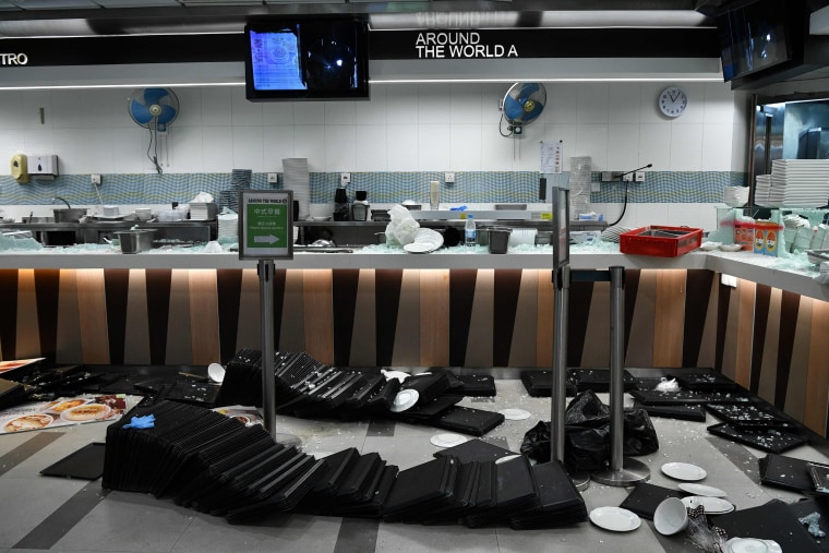 Image: Food trays and other items lay scattered around at a canteen on the Hong Kong Polytechnic University campus in the Hung Hom district of Hong Kong