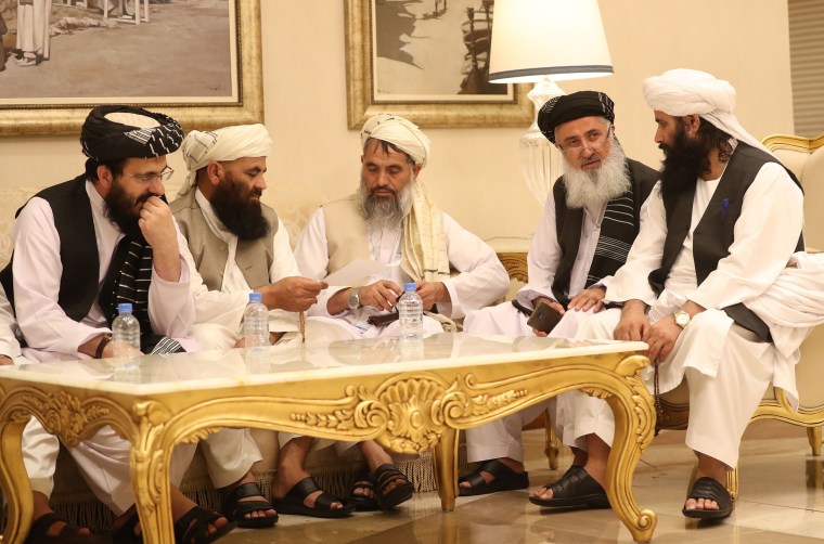 Image: Senior Afghans gather during talks with the Taliban in the Qatari capital Doha on July 8.