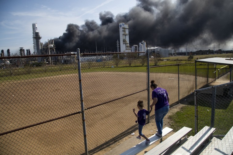 Image: Cloud of smoke in the background from the TPC Group Port Neches Operations explosion is visible from a little league baseball park on Wednesday, Nov. 27, 2019, in Port Neches, Texas.