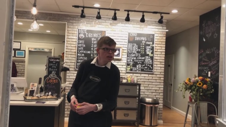 Ethan Donovan stands in the coffee shop started by his mom and longtime speech pathologist, Ethan and the Bean.