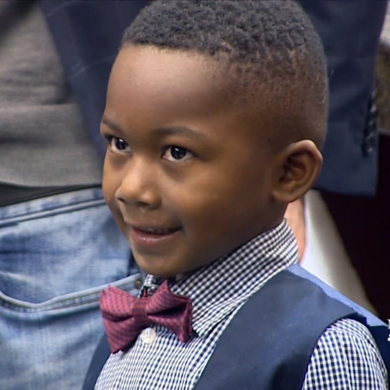 Little Michael was so excited to legally join his new family that he asked his class to come along.
