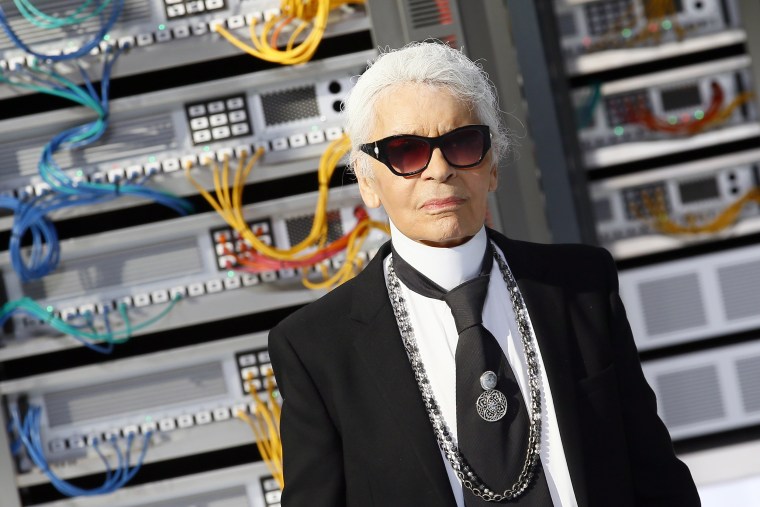 Fashion designer Karl Lagerfeld appears at the end of the presentation of Chanel's Spring-Summer 2017 ready-to-wear fashion collection presented Tuesday, Oct.4, 2016 in Paris. (AP Photo/Francois Mori)