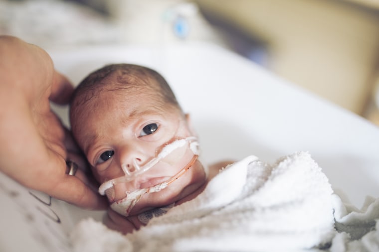 Newborn NICU baby has his first bath