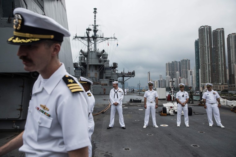 Image: Crew members standing on the deck of the USS Blue Ridge during a port call in Hong Kong