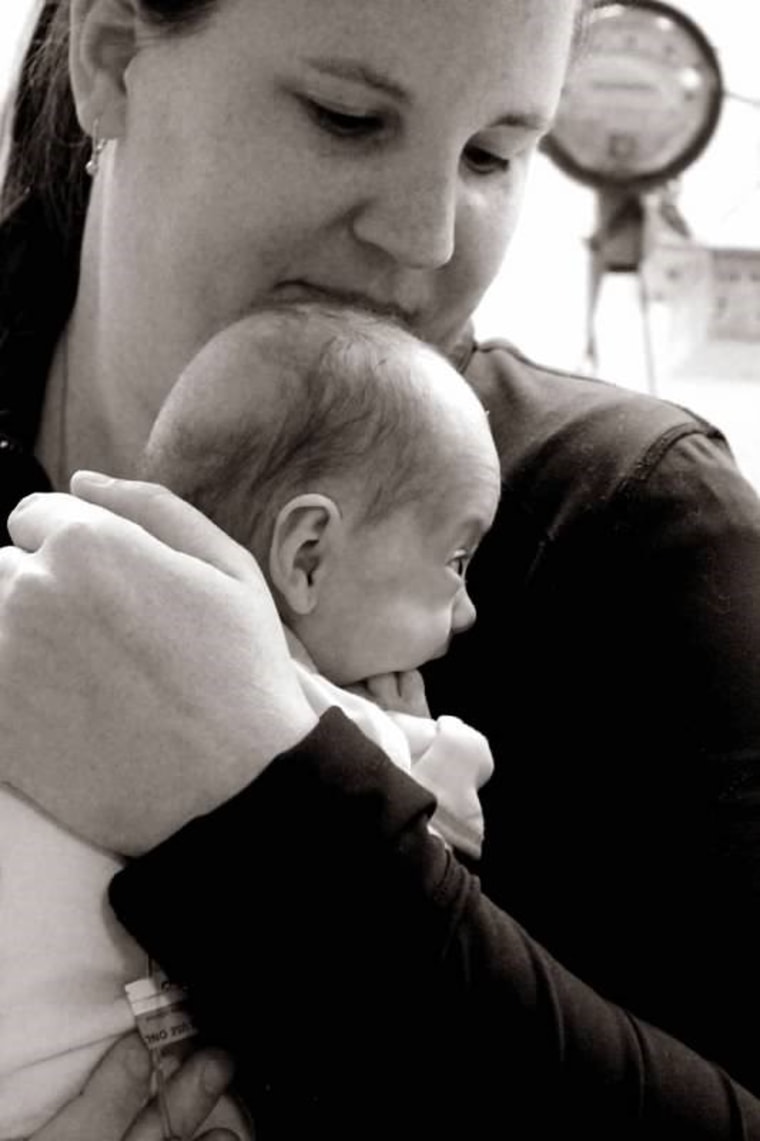 Megan Carter holds her daughter Ellie when she was in the NICU.