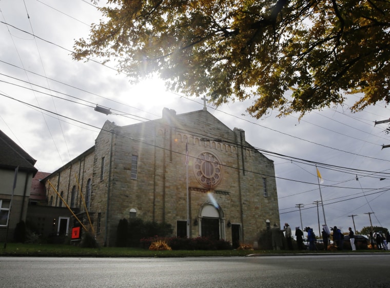 Image: Members of the media gather outside of Infant of Prague Parish before a news conference with Bishop Richard Malone, of Buffalo