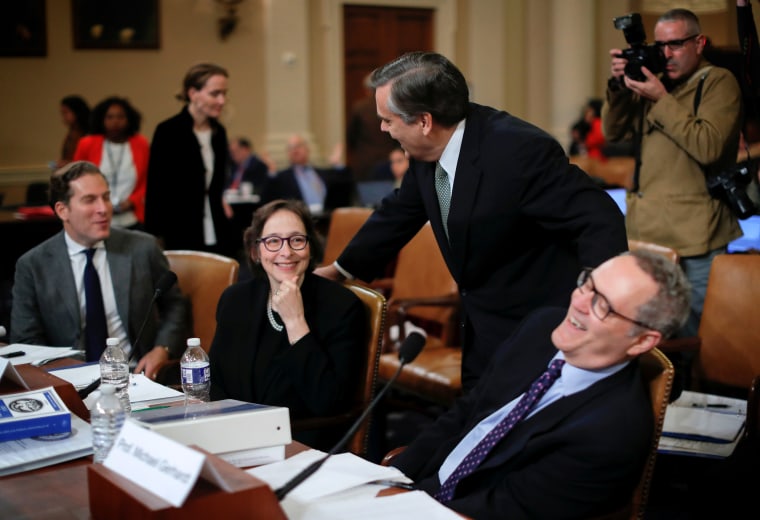 Image: Witnesses Noah Feldman, Pamela Karlan, Jonathan Turley and Michael Gerhardt share a laugh during the House Judiciary Committee hearing on Dec. 4, 2019.