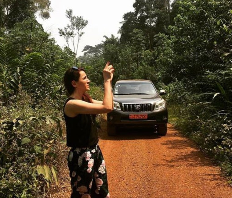 Charlotte Pawar takes photos on a jungle road in a post on her Facebook page.