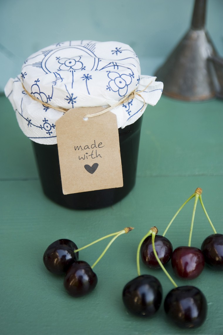 Image: Glass of homemade cherry jam and cherries