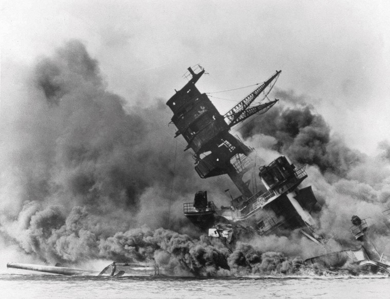 In this Dec. 7, 1941 file photo, smoke rises from the battleship USS Arizona as it sinks during the Japanese attack on Pearl Harbor, Hawaii.