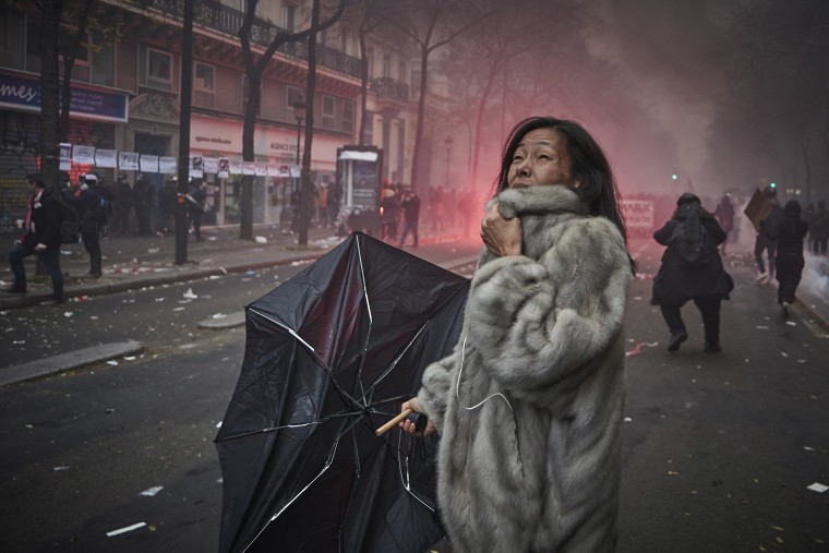 Image: A woman screams amidst clouds of tear gas as protesters and French Riot Police clash during a rally near Place de Republique on Dec. 5, 2019 in Paris, France.