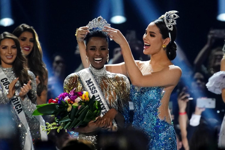 Image: Zozibini Tunzi, of South Africa, is crowned Miss Universe by her predecessor, Catriona Gray of the Philippines, at the 2019 Miss Universe pageant at Tyler Perry Studios in Atlanta