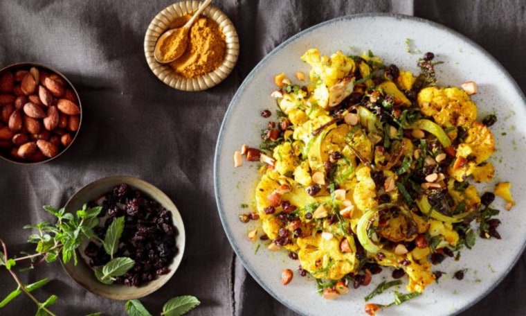 Blistered curry cauliflower with mint currants and toasted almonds