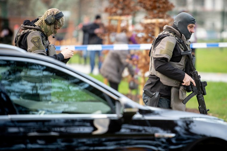 Image: Police officers are seen near the site of a shooting in front of a hospital in Ostrava, Czech Republic 