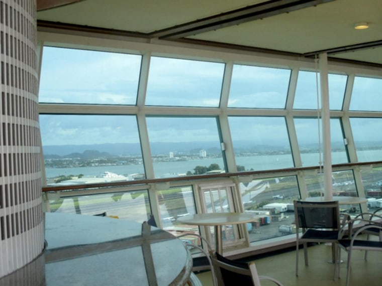 Image: The wall of glass featured three rows of glass, floor to ceiling, with a wooden rail between the middle and bottom rows.