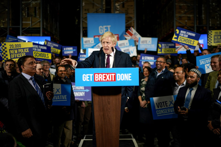 Image: British Prime Minister Boris Johnson speaks to supporters at a factory in Manchester on Dec. 10, 2019.