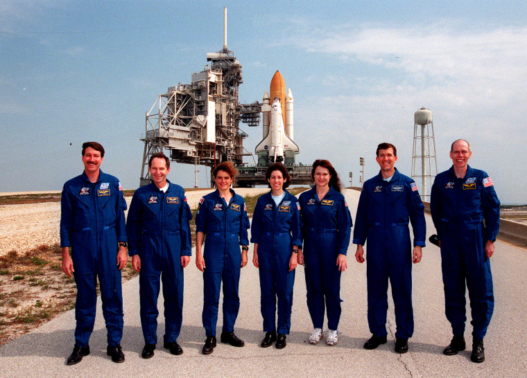 Image: Commander Kent Rominger; Mission Specialists Valery Tokarev, Julie Payette, Ellen Ochoa, Tamara Jernigan; Pilot Rick Husband; and Mission Specialist Daniel Barry, the crew of the Space Shuttle Discovery, at the launchpad in 1999.