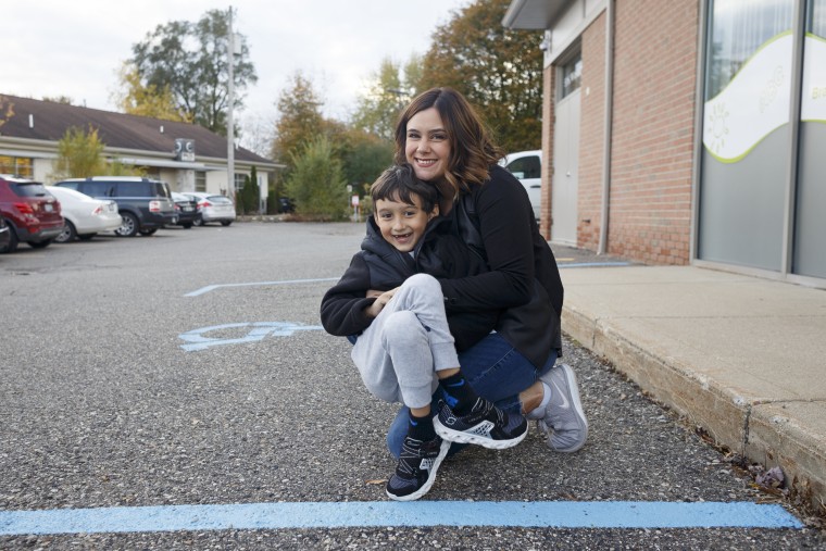 Patricia Lopez holds her son Izak after a Brain Balance session.