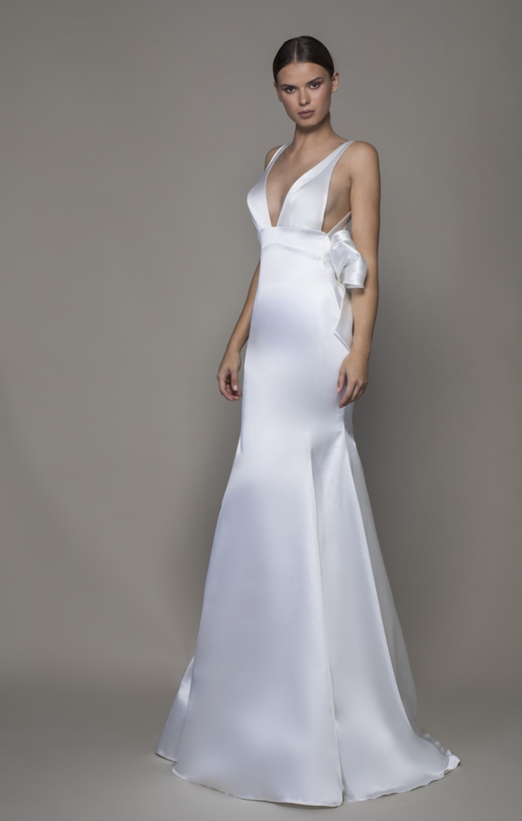 Buck the trend with simple gowns, like this asymmetrical satin sheath. 