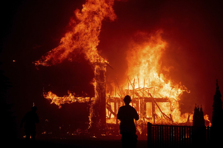 Image: A home burns as the Camp Fire rages through Paradise, Calif.