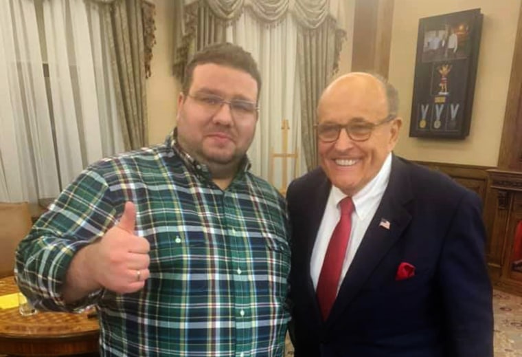 Ukrainian former diplomat Andrii Telizhenko and Rudolph Giuliani pose for a picture during a meeting in Kyiv, Ukraine, on Dec. 5, 2019.