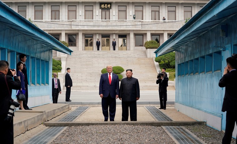 Image: President Donald Trump and North Korean leader Kim Jong Un stand at the demarcation line in the demilitarized zone separating the two Koreas, in Panmunjom, South Korea