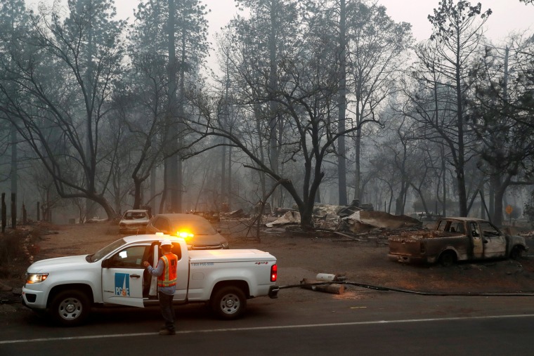 Employees of Pacific Gas & Electric work in the aftermath of the Camp Fire in Paradise, Calif., on Nov. 14, 2018.