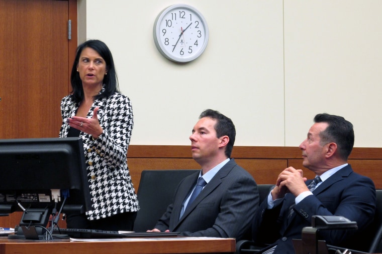 Dr. William Husel, center, sits between defense attorneys Diane Menashe and Jose Baez during a hearing on Aug. 28, 2019, in Columbus, Ohio.