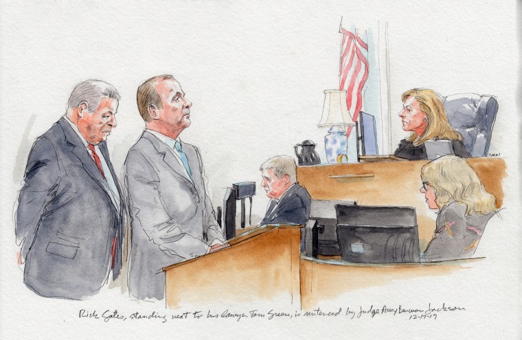Rick Gates, standing with his lawyer Tom Green, is sentenced by judge Amy Berman Jackson.