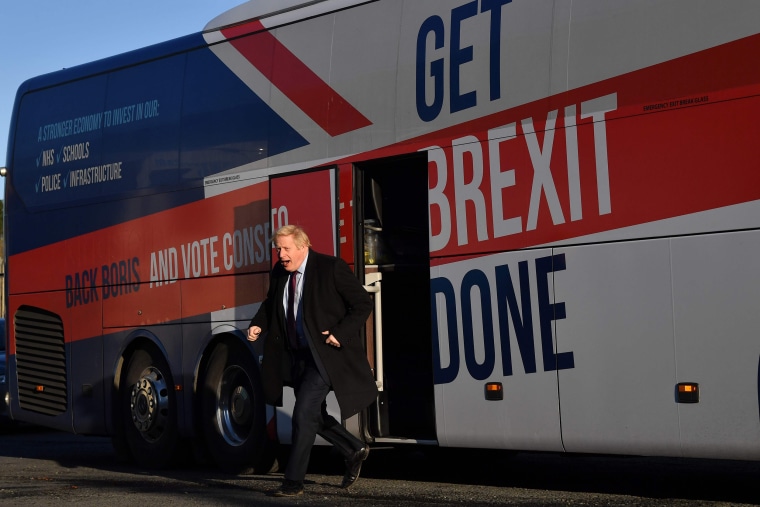 Image: Britain's Prime Minister Boris Johnson alights the 'battle bus' as he arrives for a general election campagin visit to Furgusons Transport in the town of Washington, northeast England