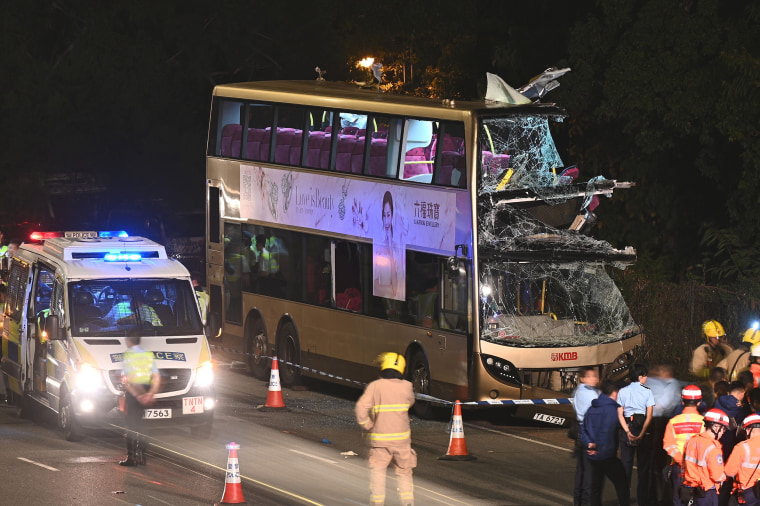 Image: Firefighters, medics and police gather near a double-decker bus after a crash in Kwu Tung in Hong Kong