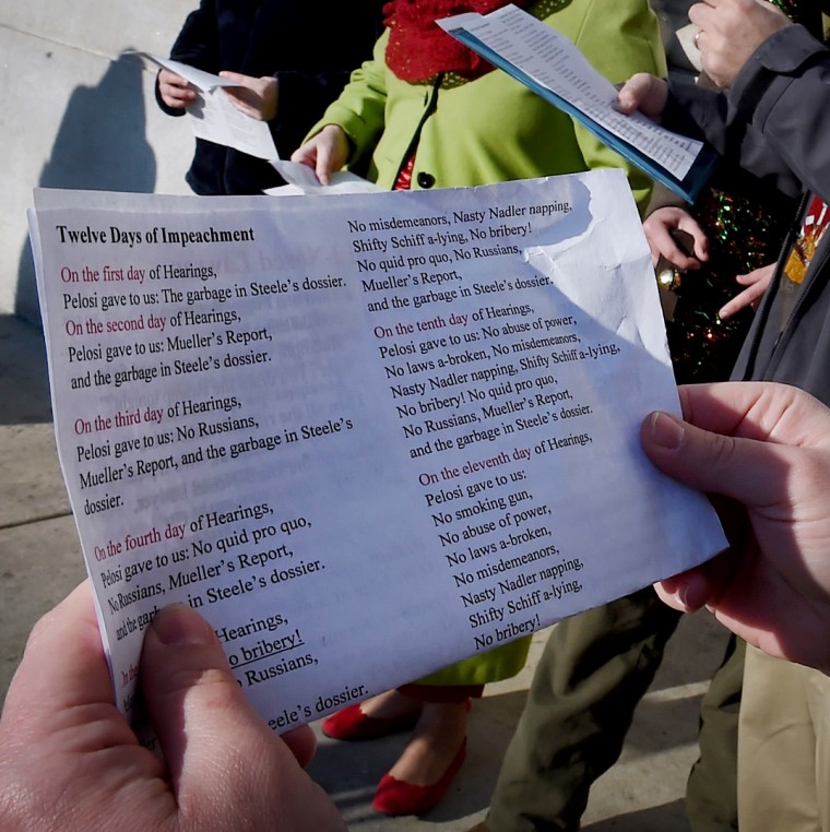 Image: Supporters of President Donald Trump sing impeachment-themed Christmas carols outside of Union Station in Washington on Dec. 18, 2019.