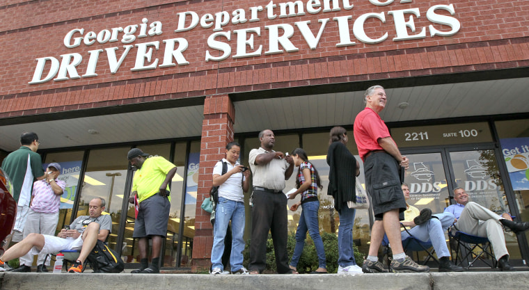 People wait on line outside the Georgia Department of Driver Services on July 6, 2012 in Atlanta.