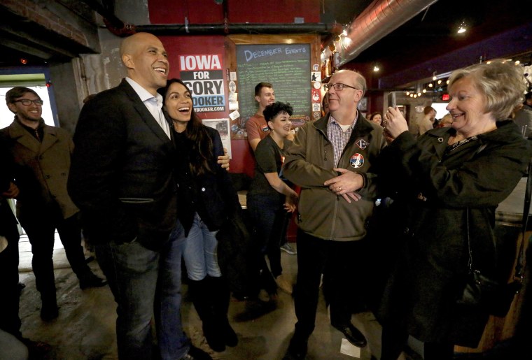 Democratic presidential candidate Sen. Cory Booker with his girlfriend, actress Rosario Dawson, at an event at Smokestack in Dubuque, Iowa, on Dec. 8, 2019.