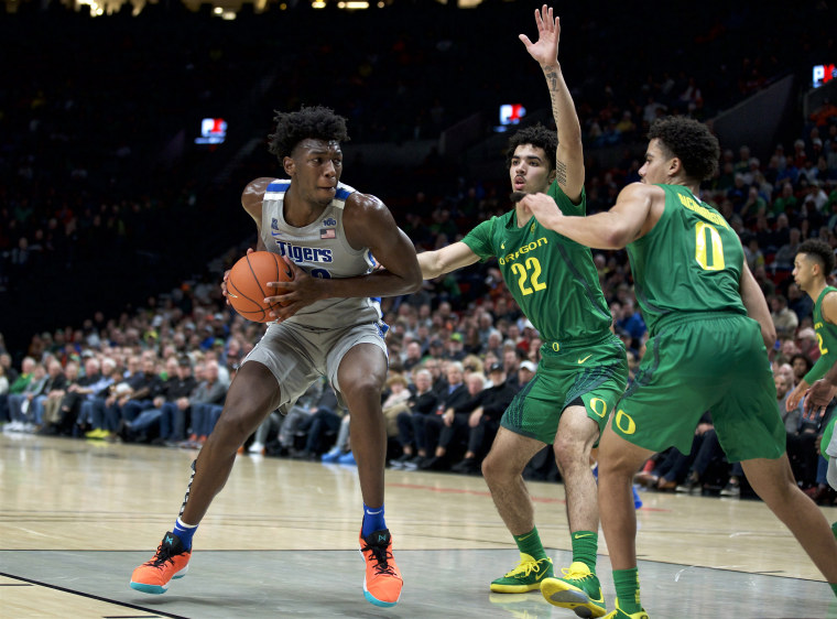 Memphis center James Wiseman drives to the basket as Oregon guards defend on Nov. 12, 2019.