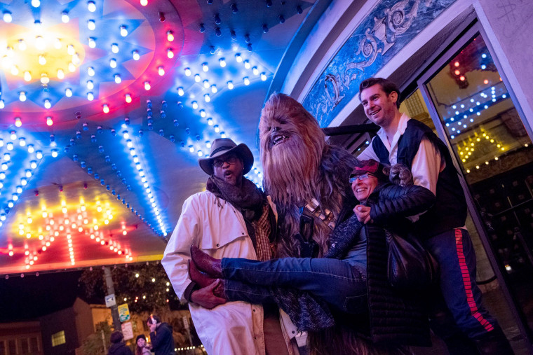 Image: Fans arrive at the Grand Lake Theater for the opening of the final chapter of the Skywalker saga 'Star Wars: The Rise of Skywalker' in Oakland