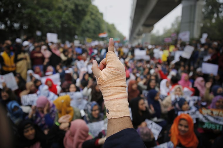 Students at the Jamia Millia Islamia University and locals participate in a protest demonstration against a new citizenship law in New Delhi, India, Saturday.