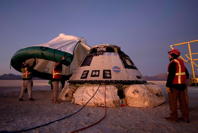 Image: Boeing, NASA and U.S. Army personnel work the scene where the Boeing CST-100 Starliner spacecraft landed after an abbreviate orbital test flight in White Sands, N.M., on Dec. 22, 2019.